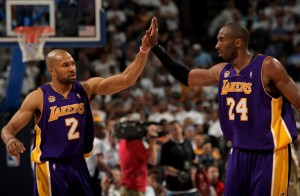 Derek Fisher and Kobe Bryant are one victory away from earning their fourth championship ring. (GETTY IMAGES)