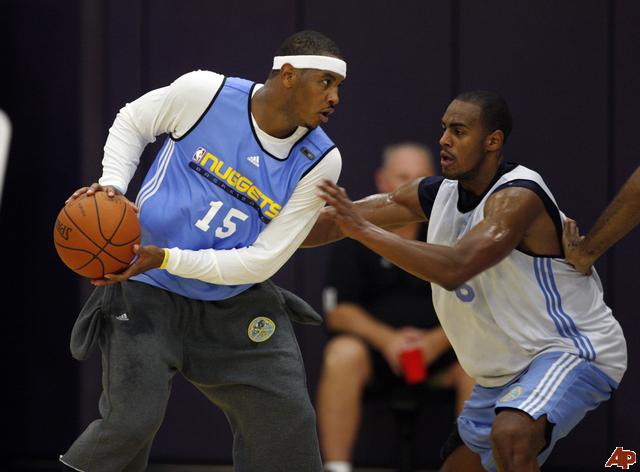 Carmelo Anthony, left, is guarded by Arron Afflalo in practice. (ASSOCIATED PRESS)