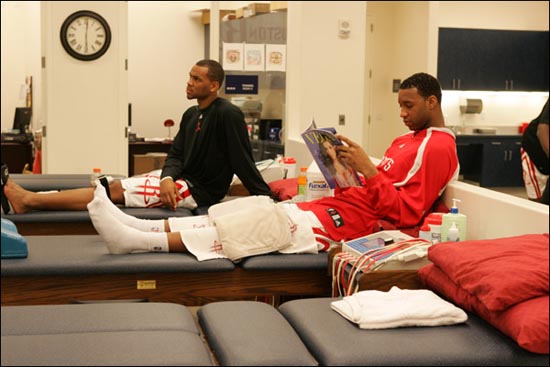 Tracy McGrady sitting on the trainer's table getting treatment. Haven't we seen this picture before.
