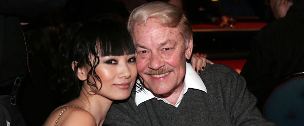 Dr. Jerry Buss, here with actress Bai Ling, loved being around beautiful women. (GETTY IMAGES)