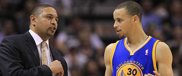 Warriors head coach Mark Jackson and guard Steph Curry talk strategy. (GETTY IMAGES)