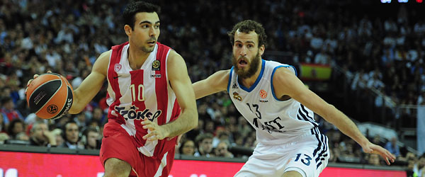 Olympiakos' Dimitrios Katsivelis is defended by Real Madrid's Sergio Rodriguez in the 2013 Euroleague final in London. (GETTY IMAGES)