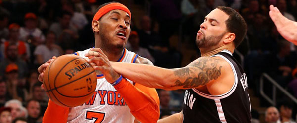 Carmelo Anthony's Knicks will be challenged by Deron Williams' Nets for top spot in the Atlantic Division. (GETTY IMAGES)